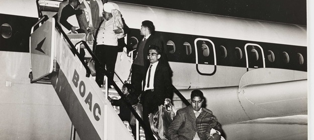 black and white image of people deplaning from BOAC airplane