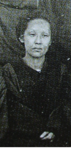 cropped black and white photograph of someone sitting