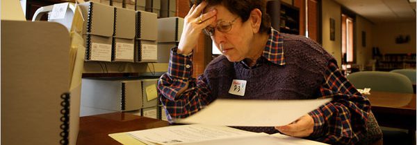 Photo of Professor Laura Kalman researching in the Reagan library archives